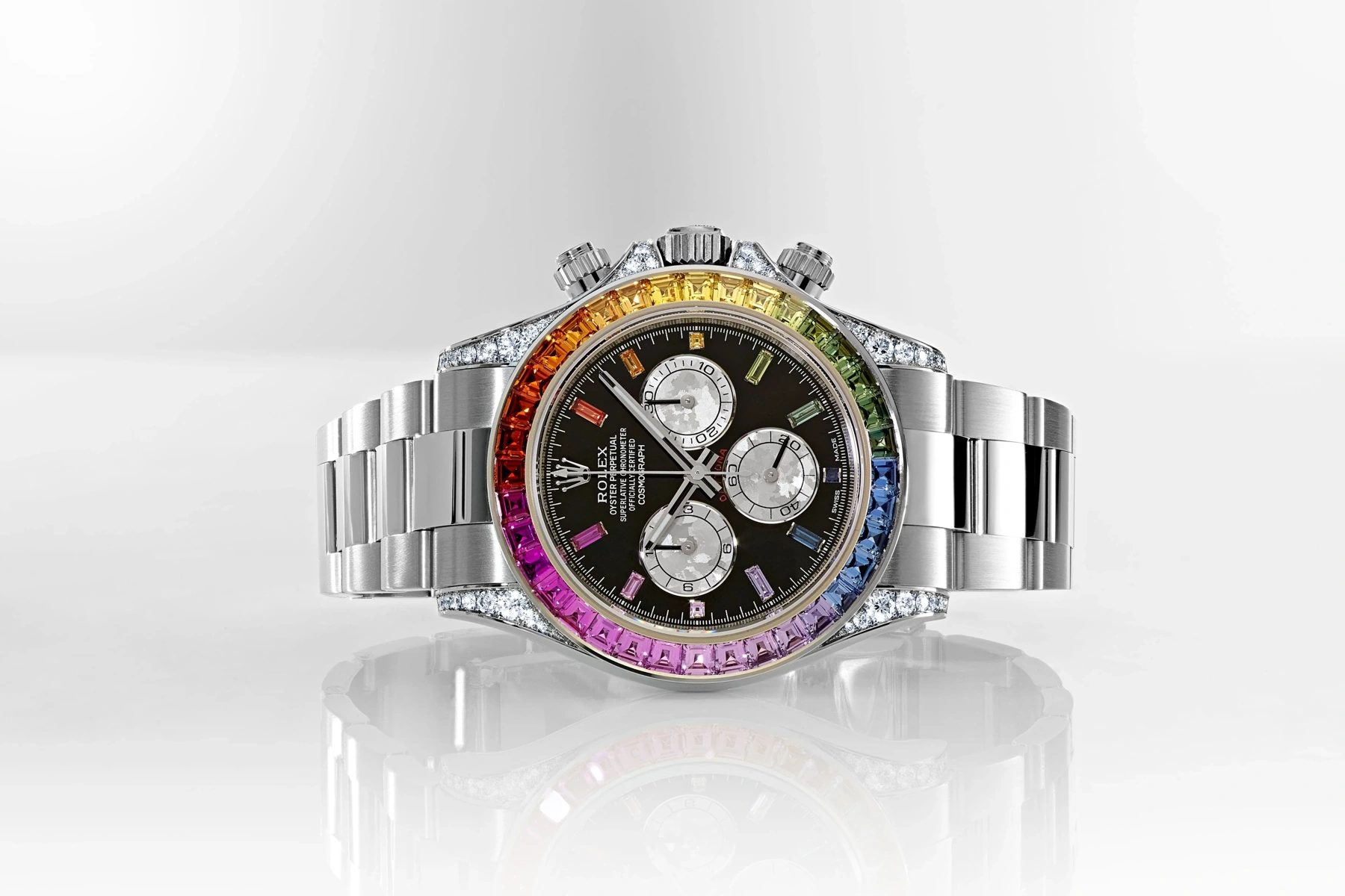 Rolex Daytona with a rainbow gem-set bezel, illustrating the brand